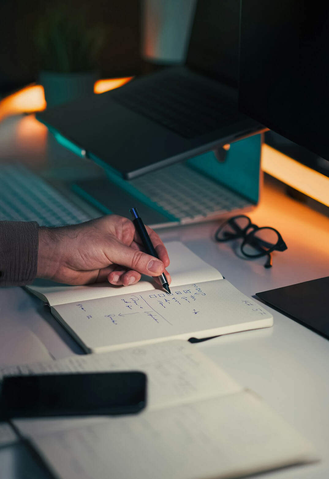 writer at desk with notebook