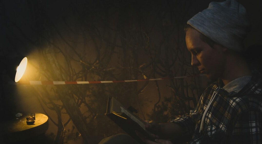 detective reading mystery novel